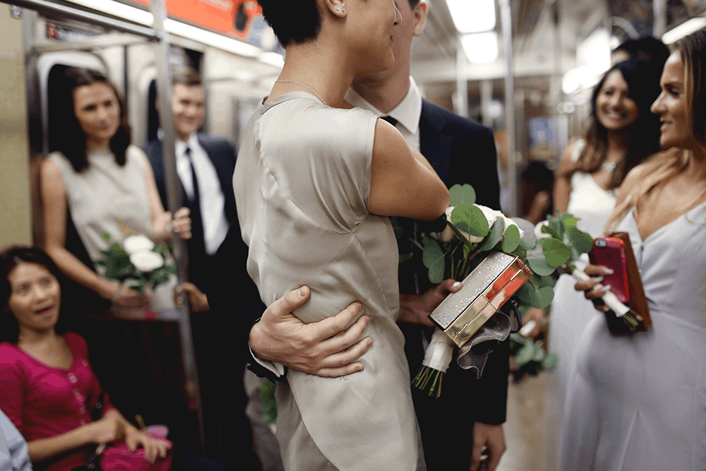 bride and groom in new york subway